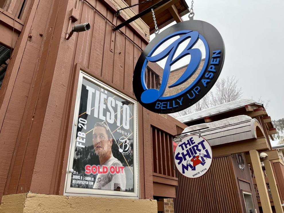 Exterior view of Belly Up Aspen featuring a sign and a poster for a sold-out Tiësto concert on February 20.